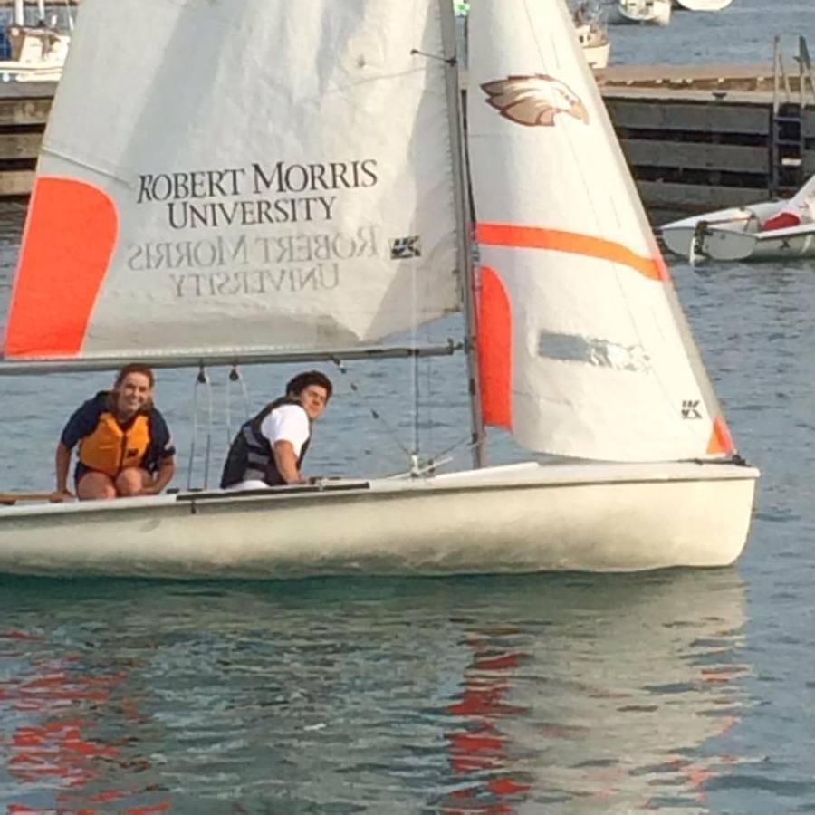 Delaney Mahon, senior, and Daniel Holland, senior, compete at a sailing meet. 