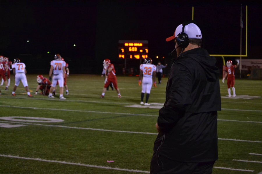 Coach Hartman watches his players on Dickinson Field.  