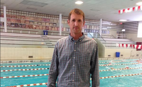 Coach Daniel Otahal stands poolside.