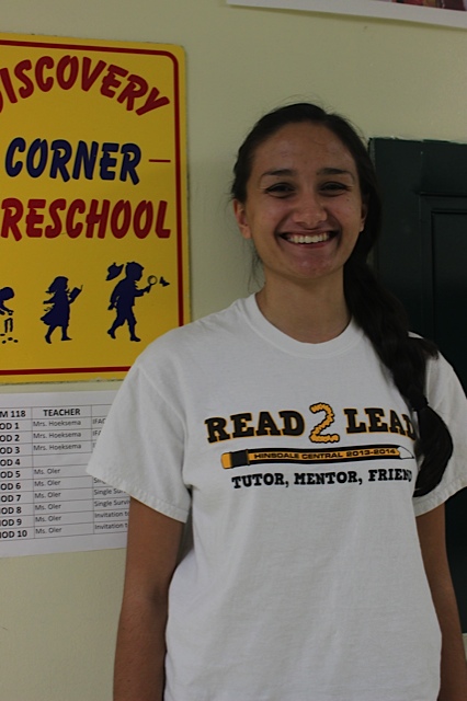 Ramasastry proudly poses near the hallway that Invite to Teach students spend most of their time. 