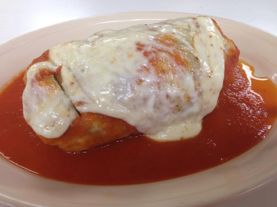 Burrito+Suizo+topped+with+melted+cheese+and+spicy+red+sauce+is+a+favorite+at+the+restaurant.+