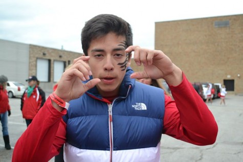 Steven Chun, senior, strikes a pose while showing his school spirit.  