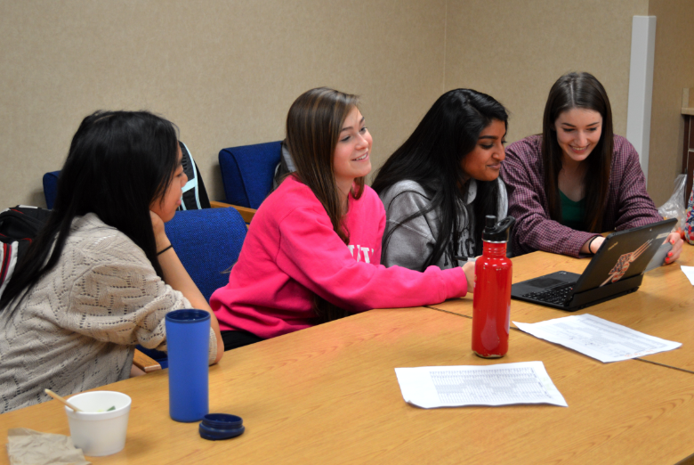 (from left to right) Stephanie Jamilla, Tillie Kummerer, Anisha Nallakrisnan, Mimi Bliiley, seniors and NHS members, work hard to come up with announcements for Rock the Cash. 