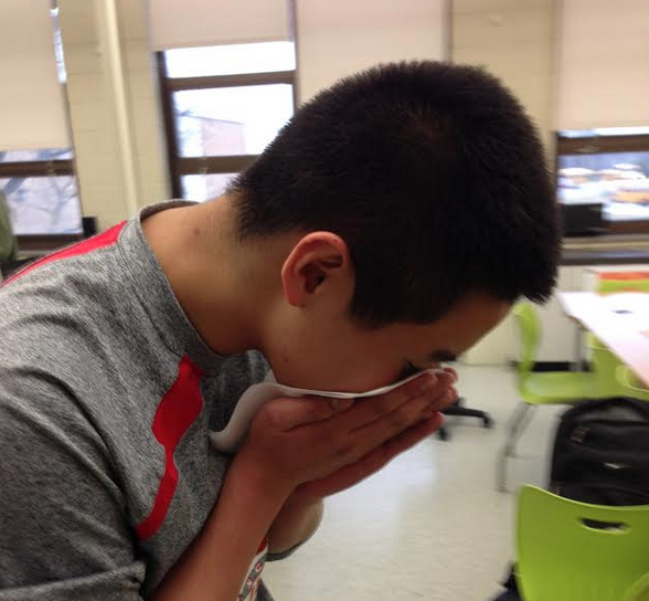 Bryte Bu, junior, sneezes as the flu spreads around Central. 