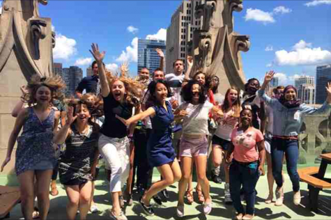 Senior Riyah Basha, far right, leaps in delight with her fellow interns at the Chicago Tribune tower. 
