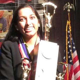 Divya Surabhi, senior, poses with the 1st place IHSA Forensics trophy. 