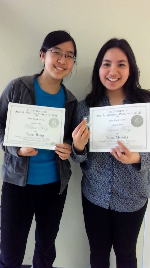 Juniors Ellen Jiang and Nina Molina display their writing awards they received from the Scholastic Art & Writing Awards competition. 