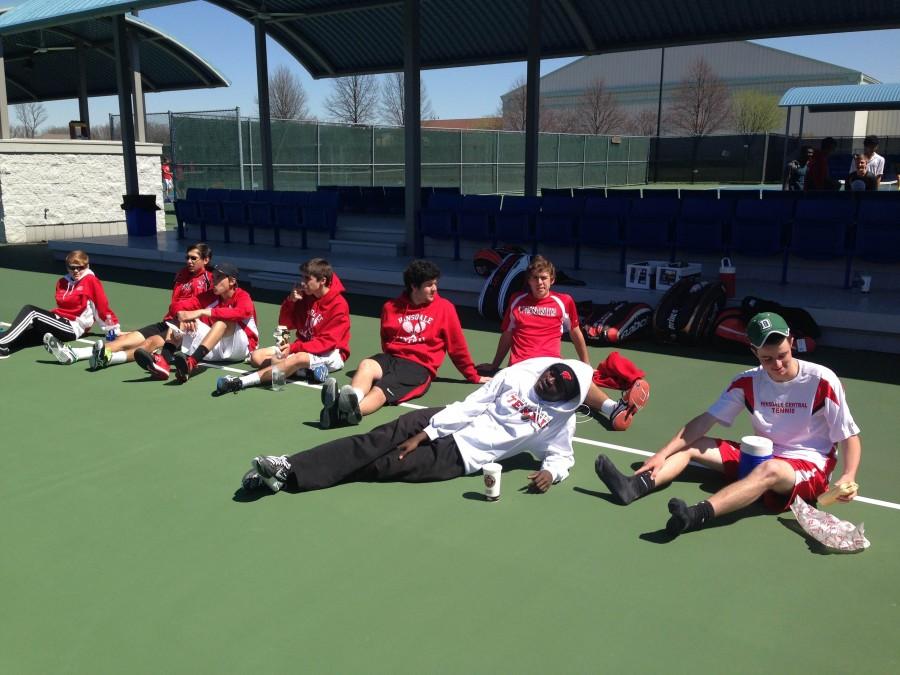 The boys Varsity tennis team watches their fellow teammates at Nationals. 