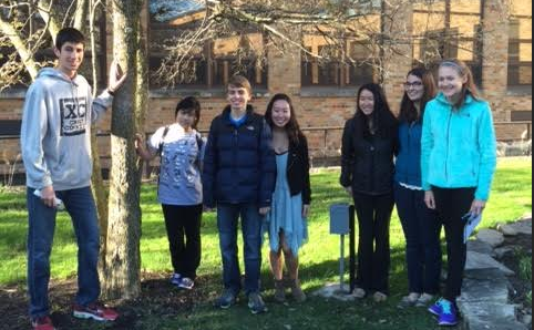 Ecology Club members, Josh Feldman, senior, Wendy Li, sophomore, Luke Schefke, sophomore, Rachel Chang, senior, Jordan Witzel, senior, Sophia Liebert, senior and Claire Callanan, freshman pose in front of newly tagged tree in the school courtyard. 