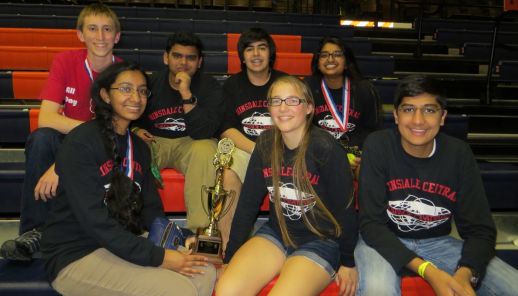 (from left to right) Seniors Brandon Weller, Priya Pillai, Kislay Bhagat, Navid Shoaee, junior, Nathalie Phillips, Anisha Nallakrishnan, and Satya Krishnan proudly sit with their 3rd place trophy. 