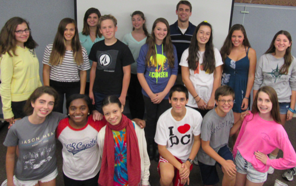 The cast of the freshmen play, Not Another Freshmen Play, pose with their director, Mr. Kostro (center back), who works in the English department. 