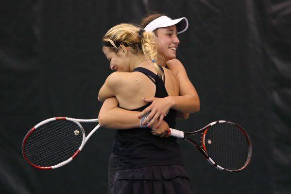 The second doubles team, Sandra Keta, senior, and Stephanie Dolehide, sophomore, take home the win at the state tournament on Oct. 24. 