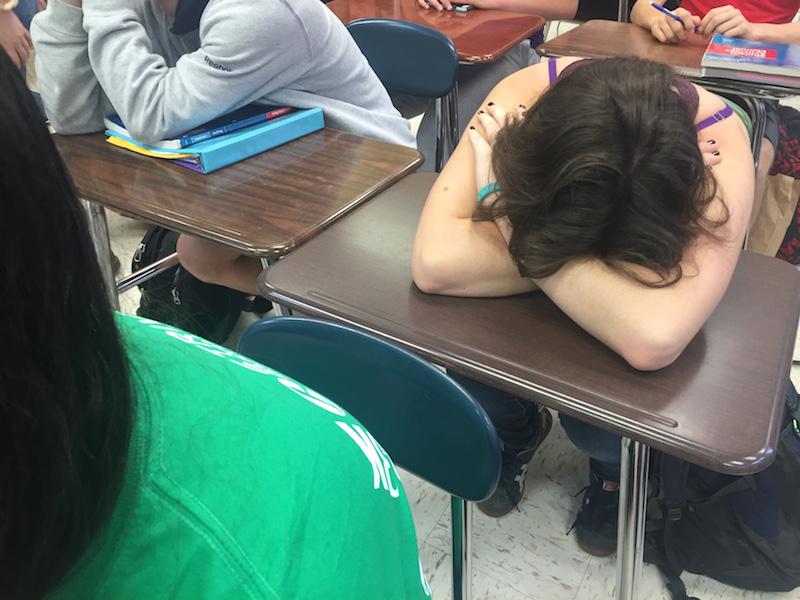 Aly Claycomb, junior, tries to catch up on sleep in class. Sleep deprivation can lead to anxiety or depression.