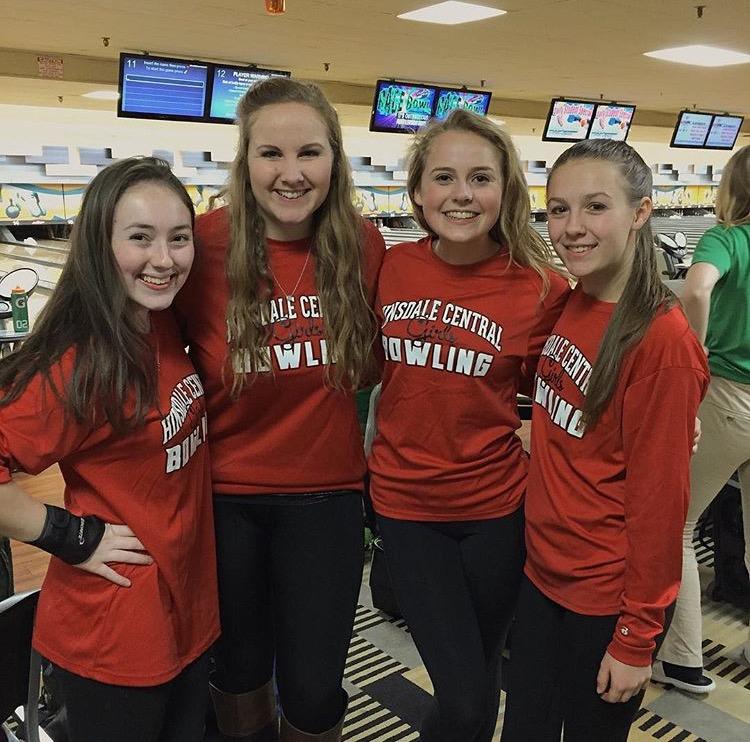 Juniors Katie Hoffman, Emma Kroeger, Sarah White and sophomore Aurora Wallat pose during a bowling tournament. 