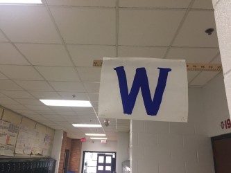 The infamous W flag, flown when the Cubs win, hangs proudly in the science hallway .