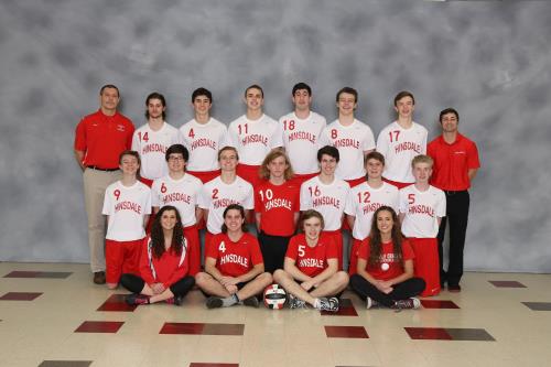 The boys' varsity volleyball team poses for a team picture. 