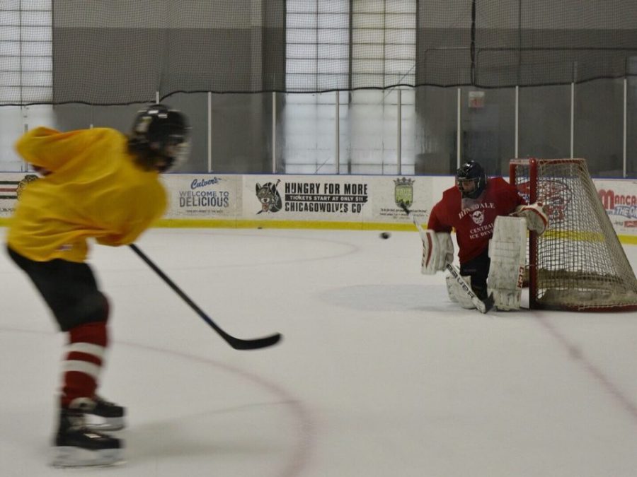 Central varsity hockey players gear up in practice to face rival Lyons Township on Oct. 7.