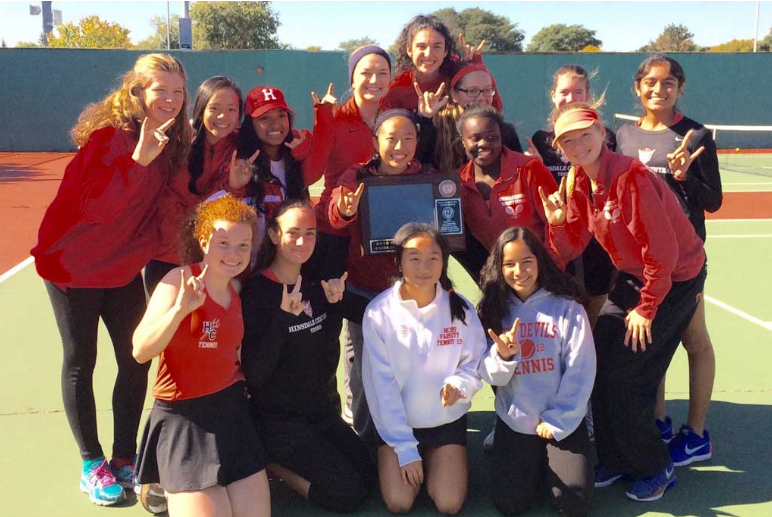 Girls tennis team poses with an award during the 2016 season.