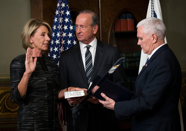 Vice President Mike Pence swears in Betsy DeVos in the Eisenhower Executive Office Building in Washington, D.C.