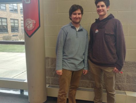 Students Ben Griffith, senior, and Connor Bower, junior, choose khakis and colored pullovers for a spring outfit. 