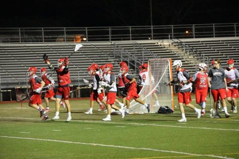 Boys Varsity Lacrosse practices on Dickinson field on the evening of  March 8.