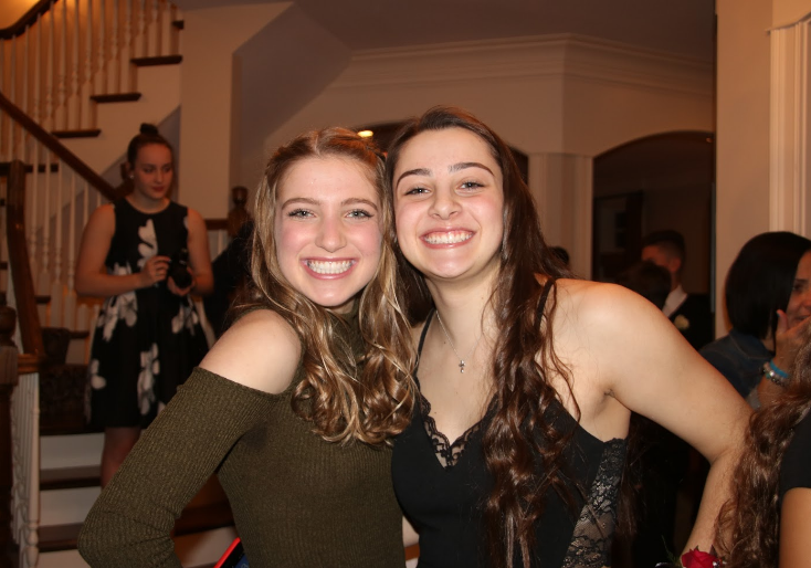 Sophomores+Samantha+Brescia+and+Caroline+Lyman+get+ready+for+the+annual+winter+dance%2C+which+took+place+on+Feb.+4.+