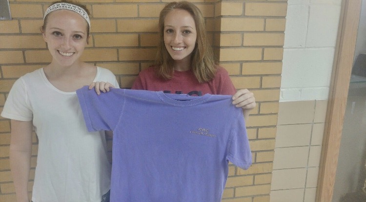 Seniors Allison & Alicia Tracey display their Brand Representative shirt. 
