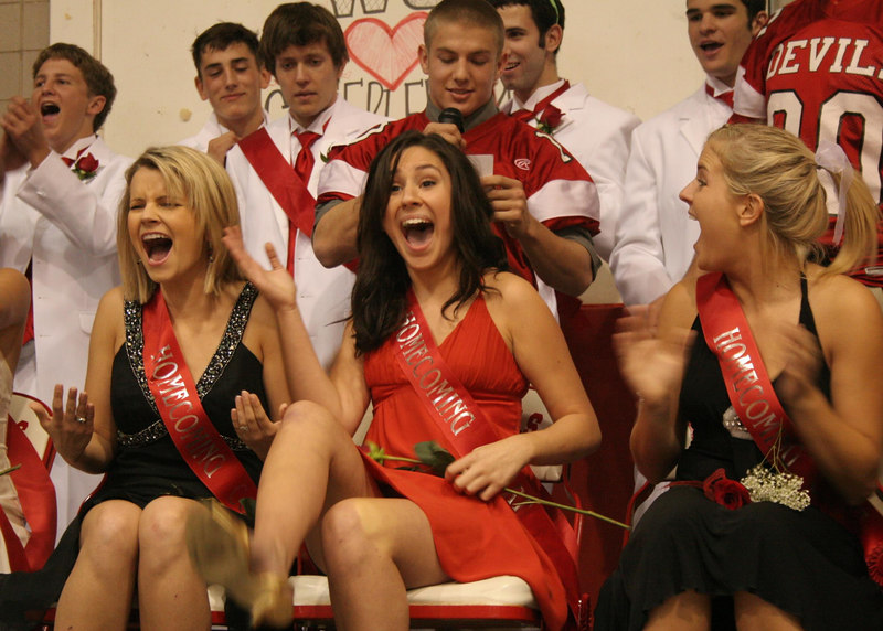 Members+of+the+2006+Homecoming+Court+celebrate+at+the+school+pep+rally.