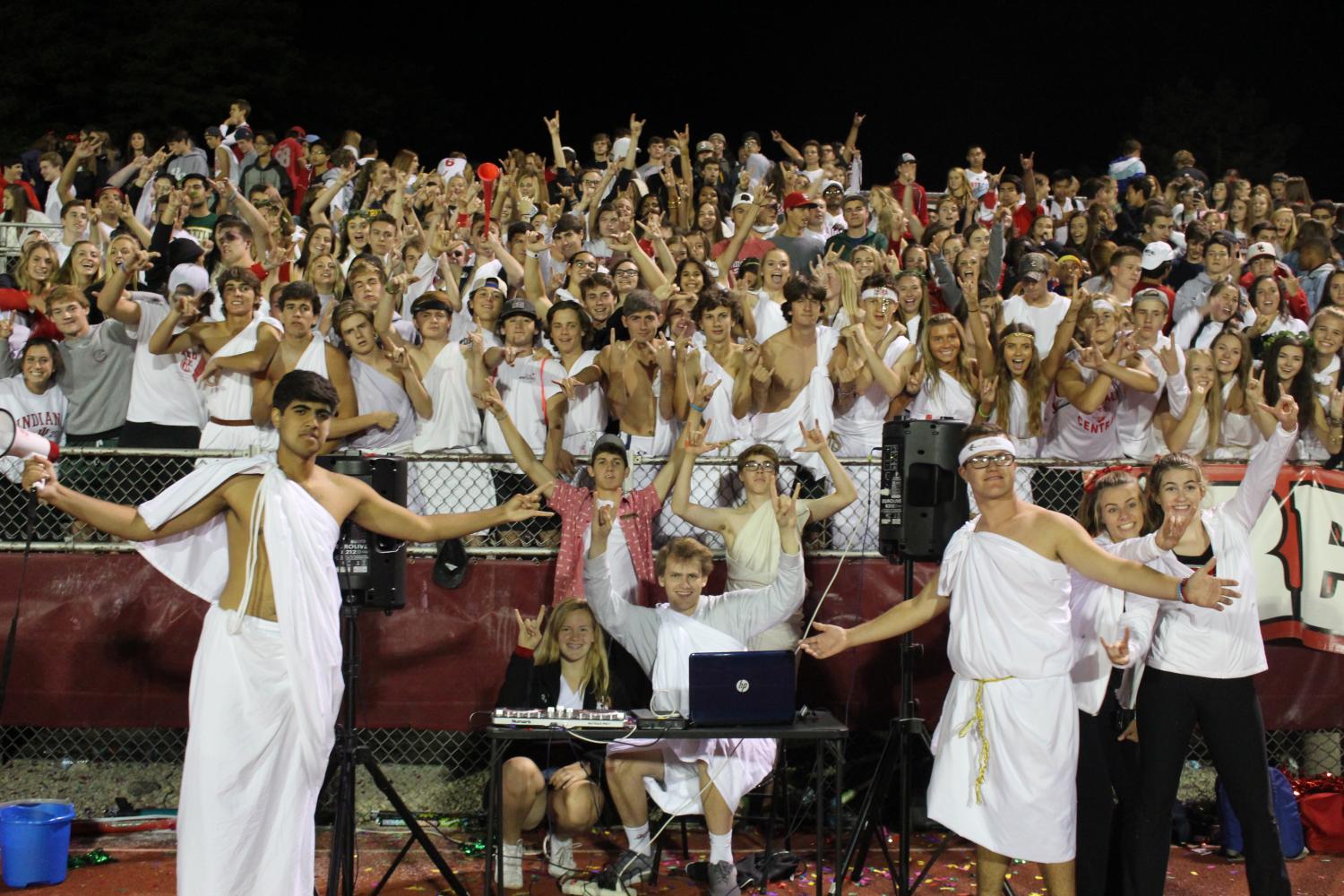 Seniors+celebrate+the+first+home+football+game+by+dressing+up+in+their+togas+for+a+fashionable+white-out.+