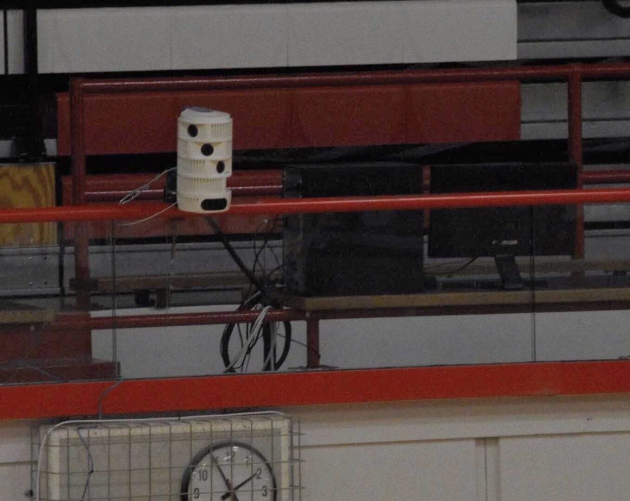A set of the cylinder-shaped cameras can also be found just above the womens locker room entrance in the main gym.