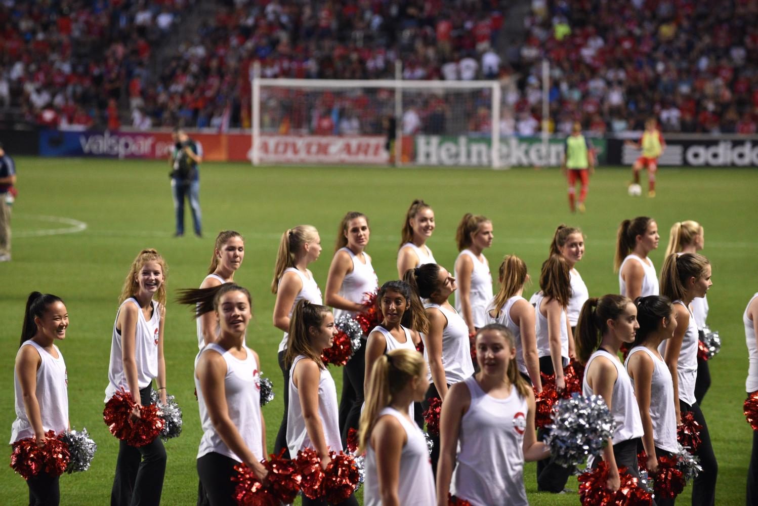 The poms team gets ready to perform in front of large crowd at Toyota Park during the halftime Chicago Fire game. 