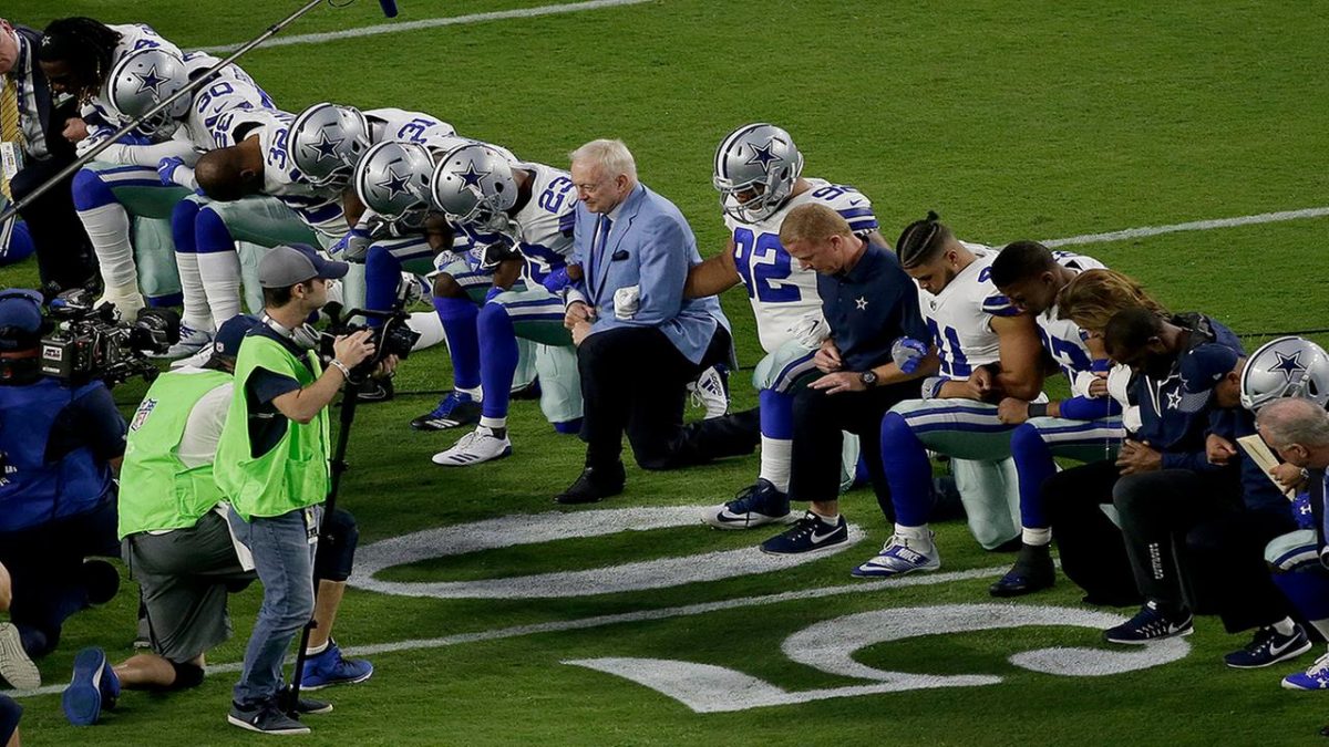 Dallas Cowboys owner, Jerry Jones, leads his team to kneel before the National Anthem on Monday, Sept. 25. 