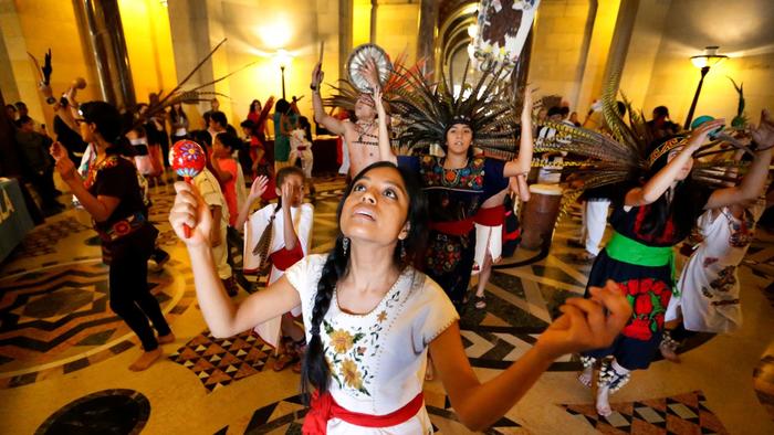 Woman celebrating Native American Heritage Month in Los Angeles, a city who chooses to celebrate Indigenous Peoples Day in lieu on Columbus Day.