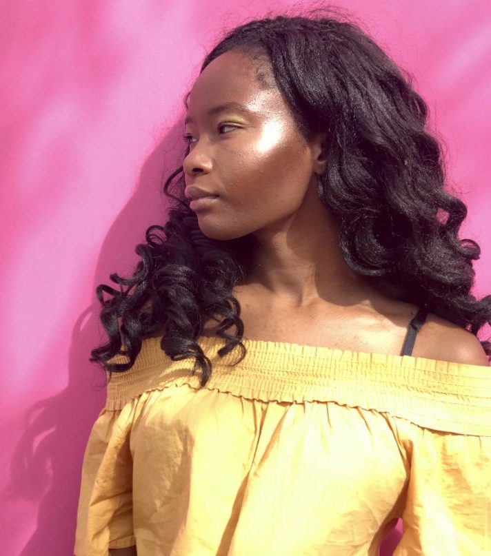Junior Ayana Otokiti wears the Pro Filtr Soft Matte Longwear Foundation in 460, Match Stix in Espresso, Sinamon and Blonde, powder highlight in Ginger Binge Moscow Mule, and the Gloss Bomb.