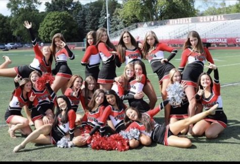 The pommers pose for a picture before the start of the football season in their devils uniforms, but for performances they wear a shiny black outfit. 