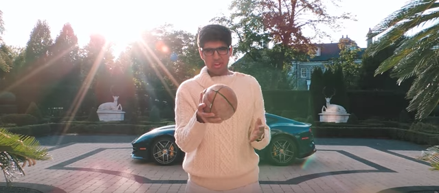 Social chair Shayan Hussain poses in the new Hype Central video for the football game against Lyons Township on Thursday, Oct. 12.  