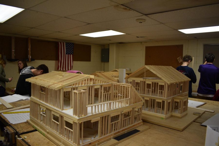 Architecture & design classes work on making models of houses.