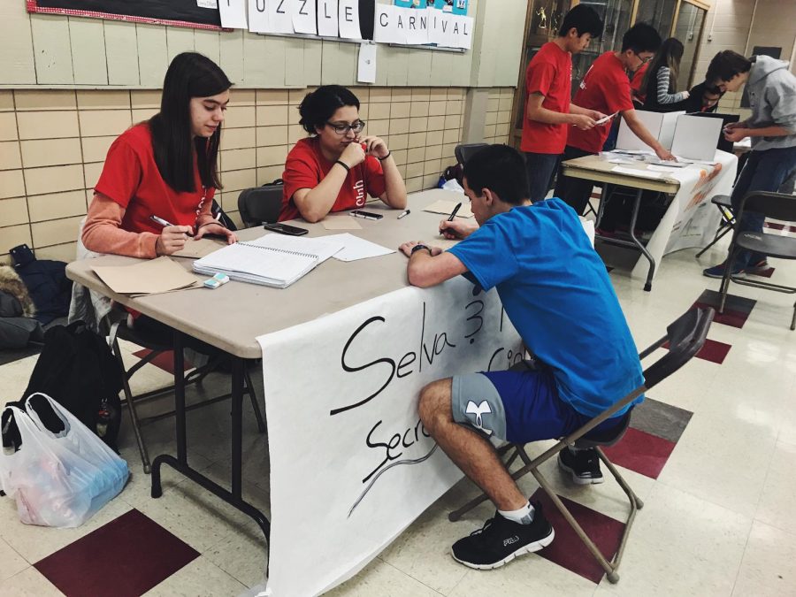 In the cafeteria there was a variety of booths all featuring different puzzles students were able to solve. 