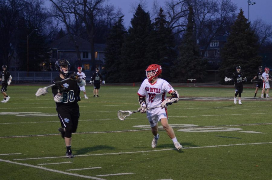 On+Wednesday%2C+March+14%2C+the+boys+varsity+lacrosse+team+played+its+home+opener+against+Highland+Park+High+School.+The+Red+Devils+won+15-3.