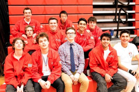 The boys gymnastics team poses at the Red vs. White meet on Feb. 23.
