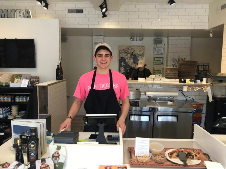 Sophomore Nic St. John waits for customers at the newly opened, family business Altamura in downtown Hinsdale. 