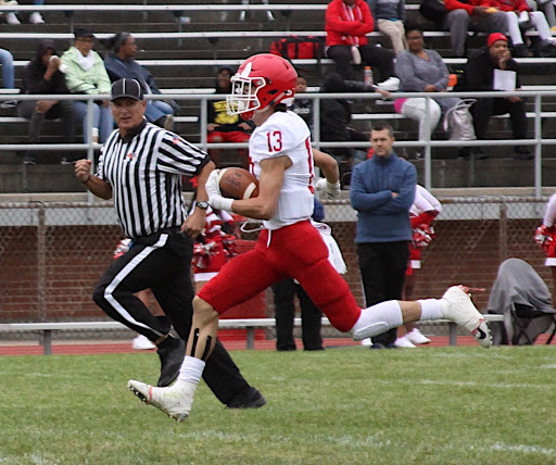 Braden Contreras junior, rushed down to the end zone for a touchdown run against Proviso West on Sept. 29.