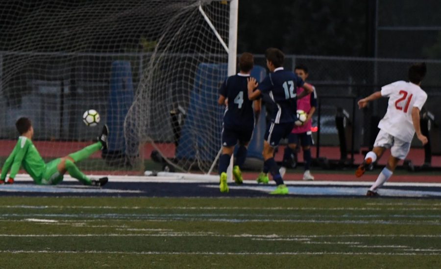 John Paul Lteif puts it into the back of the net during their game against Downers Grove South.