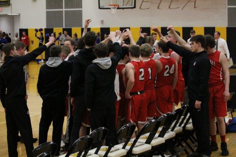 The team huddled during a timeout during their loss to Geneva on Feb. 26.