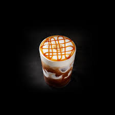 The Iced Caramel Macchiato from Starbucks is light and airy and features a layer of cold foam.