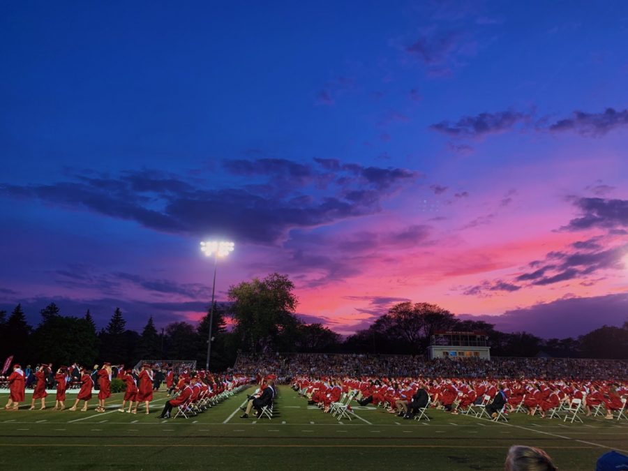 The seniors received their diplomas under clear skies, despite the initial threat of rain clouds.