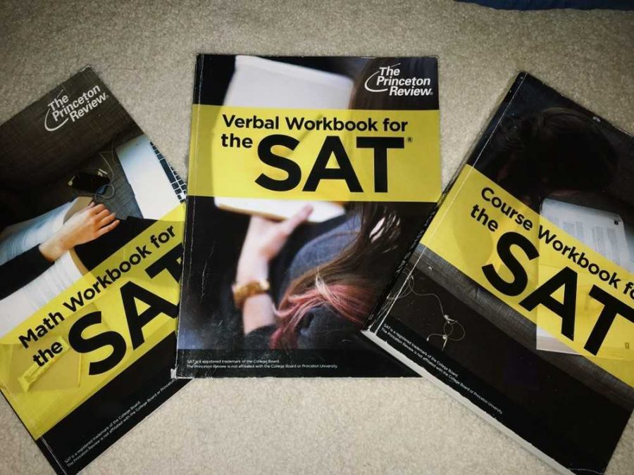 Students+use+practice+SAT+books+in+order+to+prepare+them+for+the+overwhelming+exam.