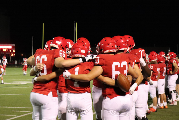The football team worked together, especially with a 
strong defense and offense, to score each touchdown against Naperville Central.