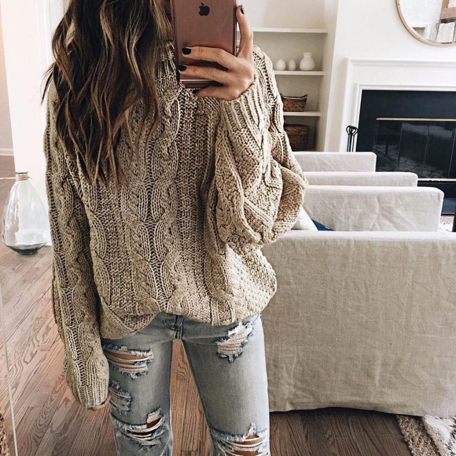A grey sweater with ripped jeans is a great casual outfit for weekdays. 