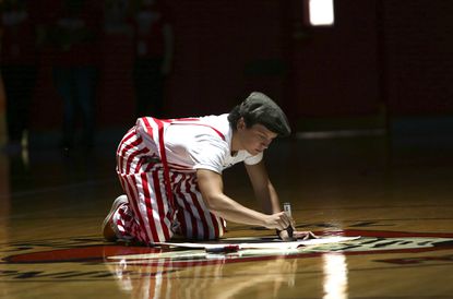 Senior Alex Ovan pumps the crowd up at an all school assembly, one of his many jobs as co-social chair. 